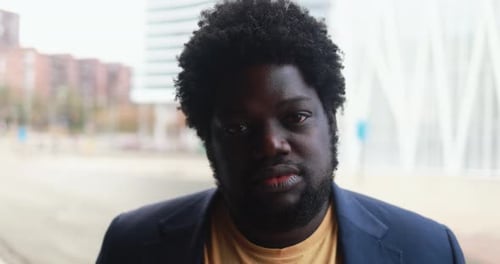 African plus size man looking on camera