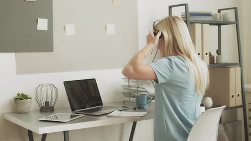 Businesswoman Ends Virtual Meeting in Bright Office