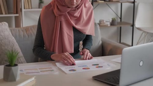 Young Adult Analyzing Data at Home