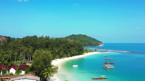 Calm bay of tropical island with white sandy beach under palm trees, washed by turquoise lagoon full
