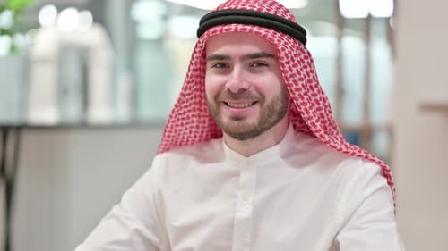 Smiling Man in Keffiyeh Portrait in Office Setting