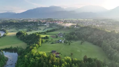 Flying over a river in mist on a beautiful sunrise