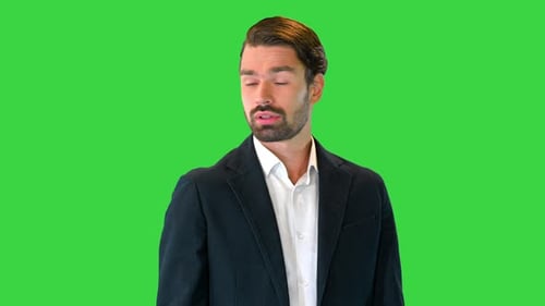 Business Man Waiting and Using a Smart Watch To Check Message on a Green Screen Chroma Key