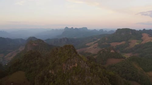 Aerial top view of forest trees and green mountain hills. Nature landscape background, Thailand.