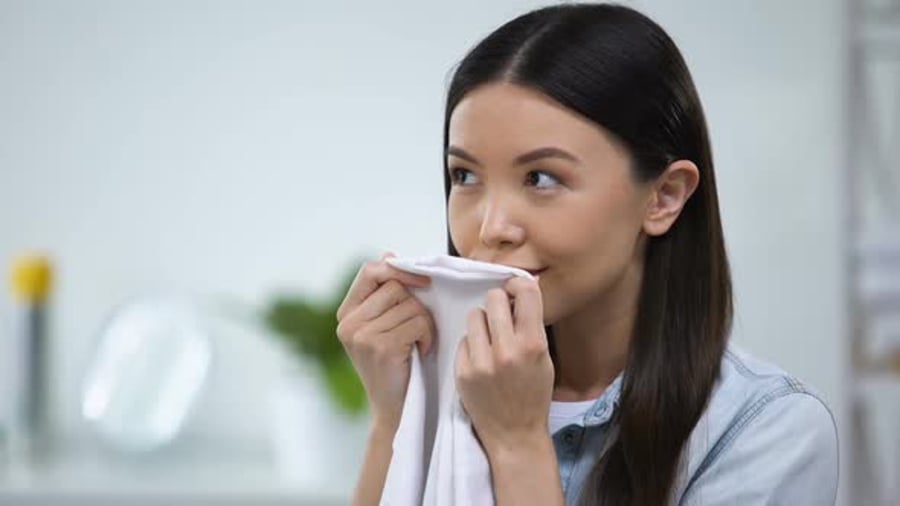 Young Woman Smelling Clean Laundry in Bright Home, People Stock Footage ...
