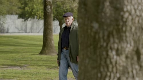 Senior Caucasian Couple Walking in Park on Warm Autumn Day
