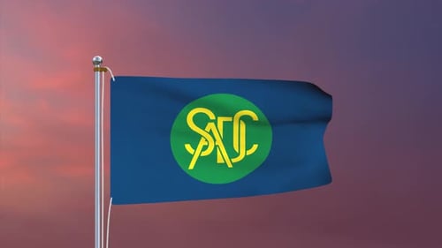 Waving Flag with Custom Logo Animation Against Sunset Sky