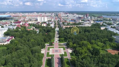 Town square in the park in summer cloudly day - Drone Footage