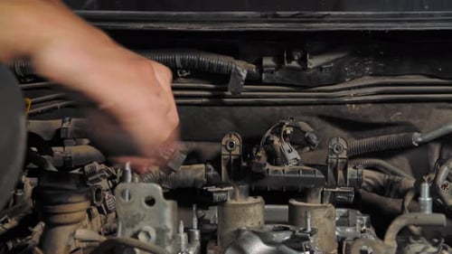 Close Up Shot of the Mechanic, Who Screws Bolts. (UHD)