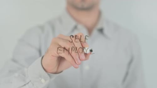 Writing Self Employed on a Clear Surface