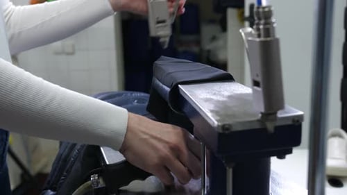 Hands of Woman Using Equipment for Dry Cleaning