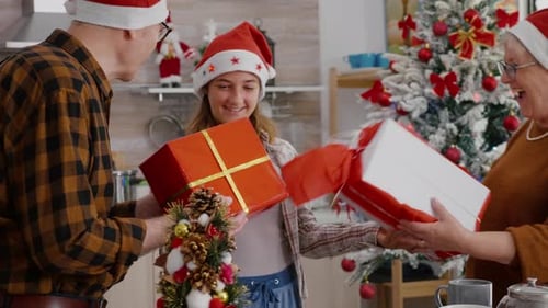 Family Exchanging Christmas Gifts at Home