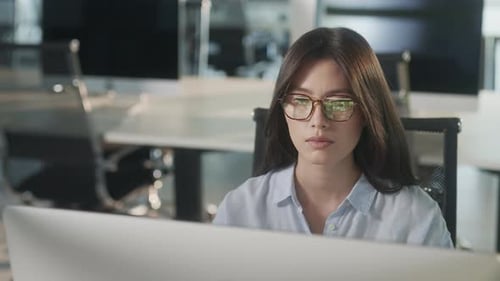 Professional Creative Woman Sitting At His Desk In Home Office Studio Working Surfing On a Laptop