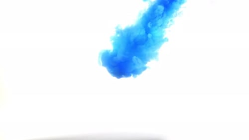 Blue Ink Swirling in White Background