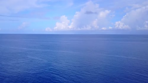 Drone aerial scenery of lagoon beach by blue ocean with sand background