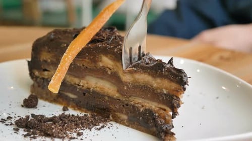 Vegetarian Cafe Visitor Inputs Fork Into Vegan Cake Slice