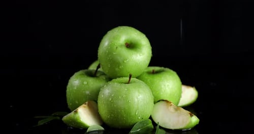 Rain Drops Falling on Fresh Green Apples.