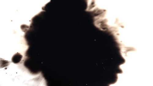 Expanding Black Ink Creating Abstract Texture