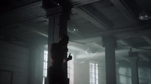 Kickboxer Training in Loft Building