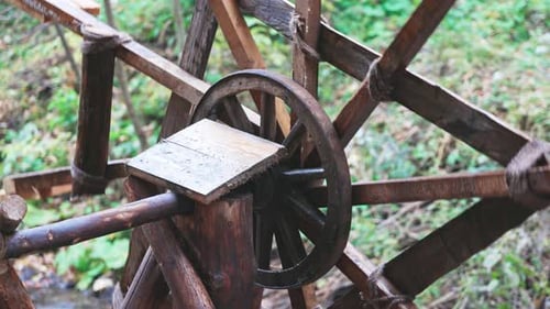 The Mill Drives the Water in the River in the Autumn Forest in Cloudy Weather