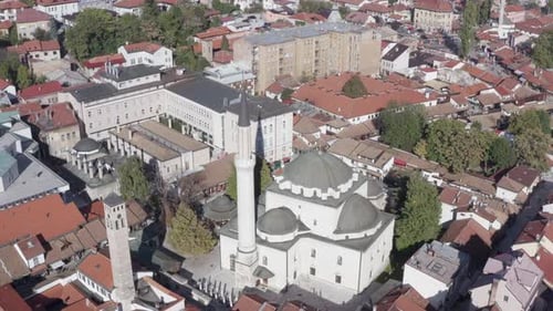 Drone Flying Over the Historic Mosque with a Minaret Standing in the City Center