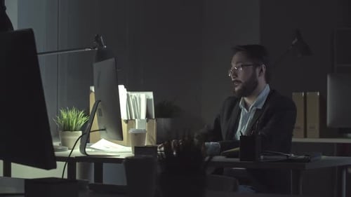 Man Finishing Report at Night before Deadline