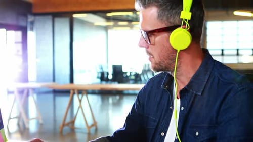 Man Working on Computer in Modern Office