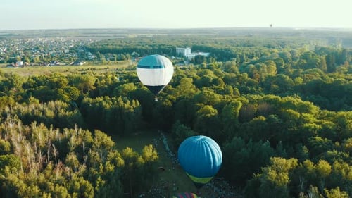 Hot Air Balloons Takes Off Among the Trees in the Park During the Festival. Aerial View From Above
