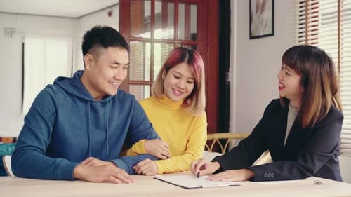 Couple Meeting With Financial Advisor at Home