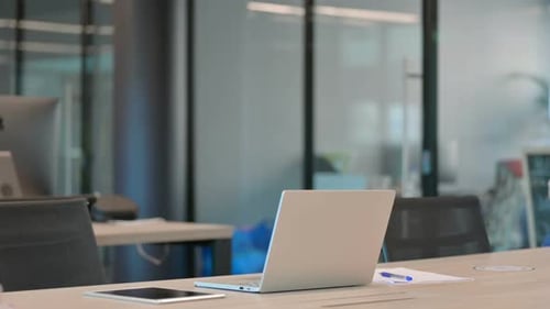 Mature Adult Man Coming in Office Using Laptop