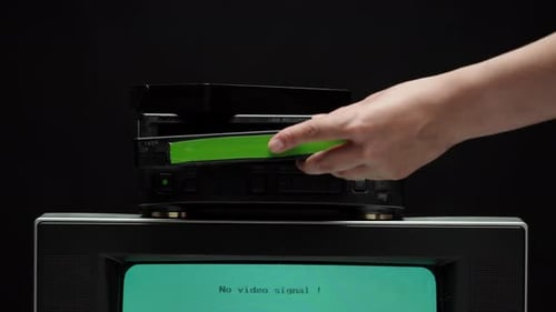 Putting Video Cassette Into Recorder