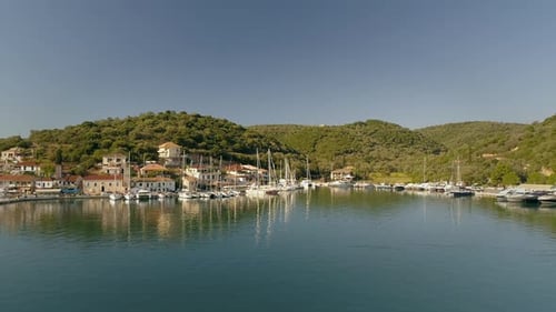 Aerial view of group of boats anchored on coast of mediterranean sea, Greece.