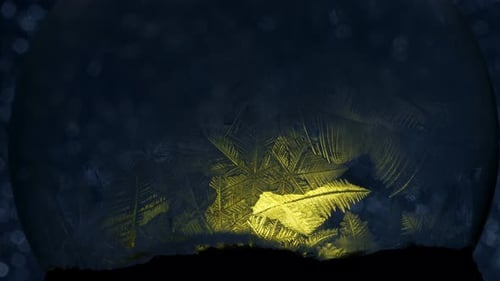 Abstract Frost Patterns Inside Glass Sphere with Golden Glow