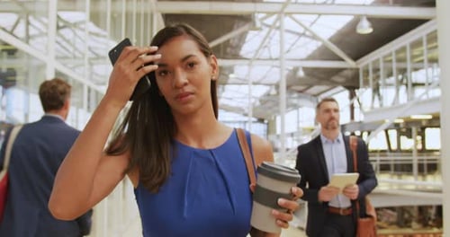 Business Woman Walking Confidently in Modern Office