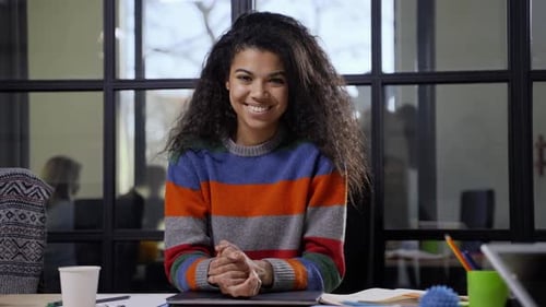 Pretty Mixed Race Woman Posing on Camera in Office