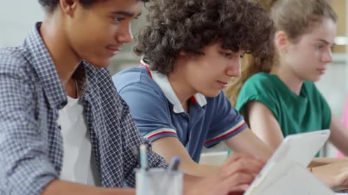 Teenagers Working on Computers