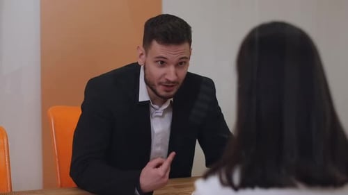 Portrait of Angry CEO Yelling Scolding Employee in Office Indoors