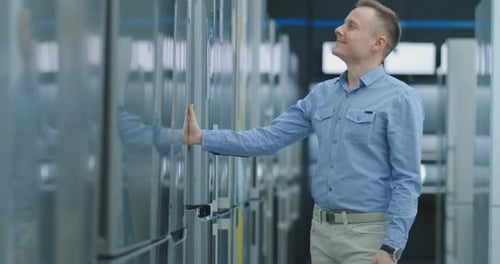 Man Shopping for New Refrigerator in Appliance Store