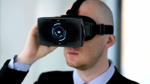 Man Uses Virtual Reality Headset in Workplace