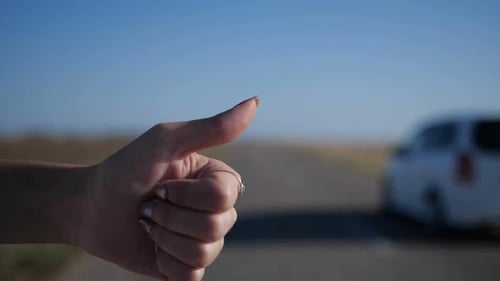 Hand Hitchhiking on a Country Road