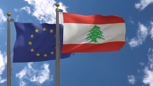 European Union and Lebanon Flags Waving Under Cloudy Sky