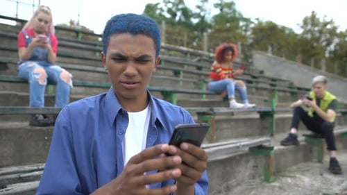 Annoyed School Teenager Scrolling Nasty Photos Smartphone App, Internet Cruelty