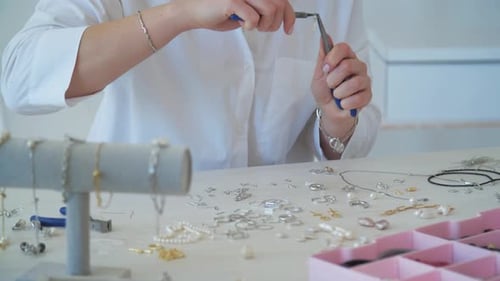 Woman Designing Jewelry at Bright Table