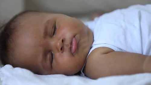 Infant Napping Peacefully in a Home Setting