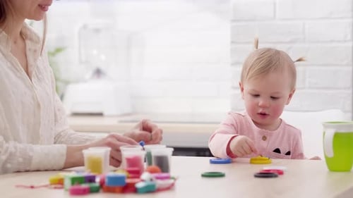 Mother and Child Playing with Colorful Plasticine