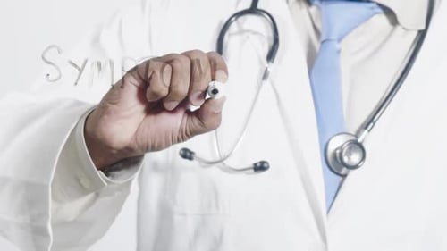 Doctor Writes 'Symptoms' on Clear Surface