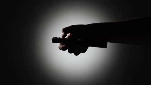 TV Remote Control Changing channels.Silhouette