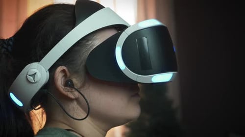 Teen Playing Video Games with VR Headset