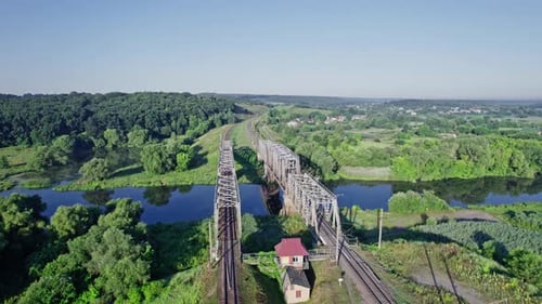 Railroad Bridge and River at Beautiful Sunlight in Summer