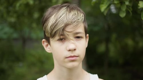 Teen Boy with Trendy Haircut Outside